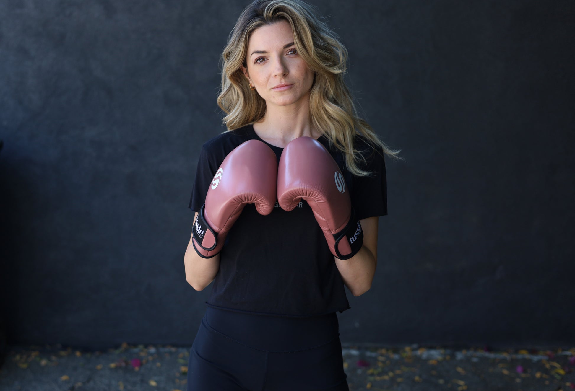 Female boxer wearing velcro wrist gloves